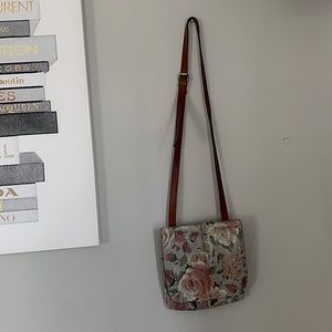 Exclusive Patricia Nash cross body bag. Floral print with gold embossed hardware